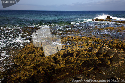 Image of rock stone sky cloud beach  water  lanzarote spain 