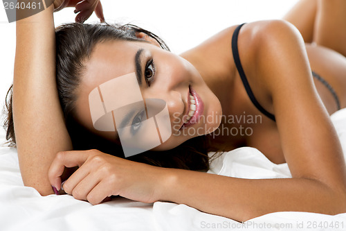 Image of Sexy woman lying on the bed