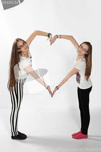 Image of Two sisters and heart