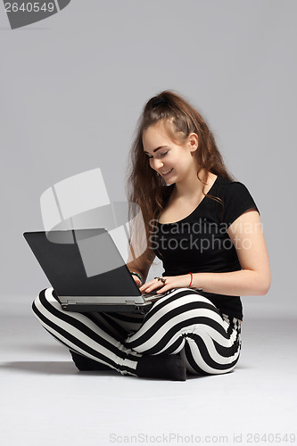 Image of Teenager girl with laptop