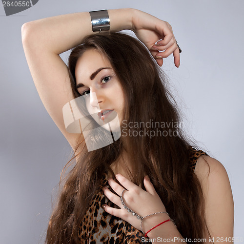 Image of Long-haired teenager girl in leopard dress