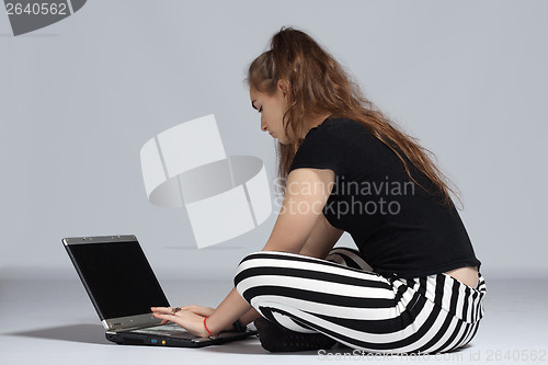 Image of Teenager girl with laptop