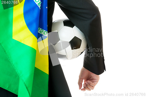 Image of Supporter with brazil flag holding soccer ball