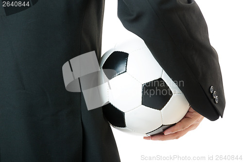 Image of Back view of Businessman holding soccer ball 