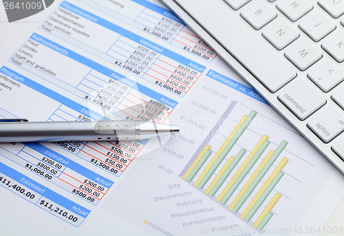 Image of Data graph with keyboard and pen