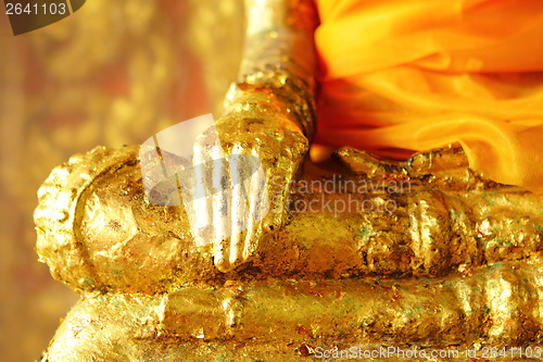 Image of Buddha statue with golden foil