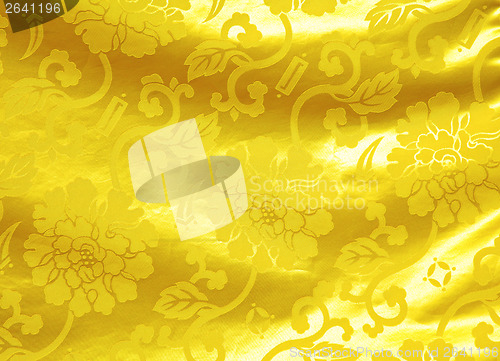 Image of Golden silk with flower pattern