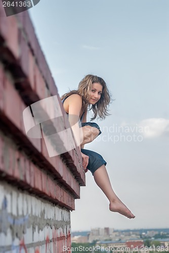 Image of Pretty girl on roof