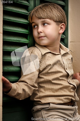 Image of Boy at shuttered window