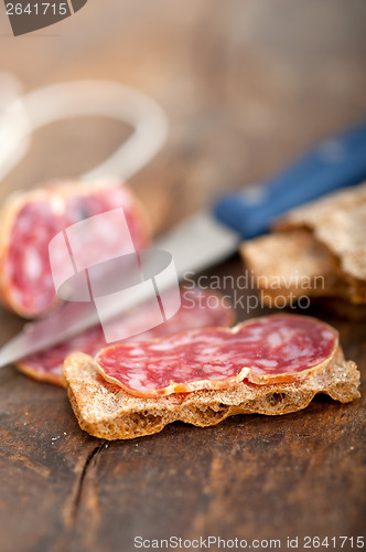 Image of italian salame pressato pressed slicing