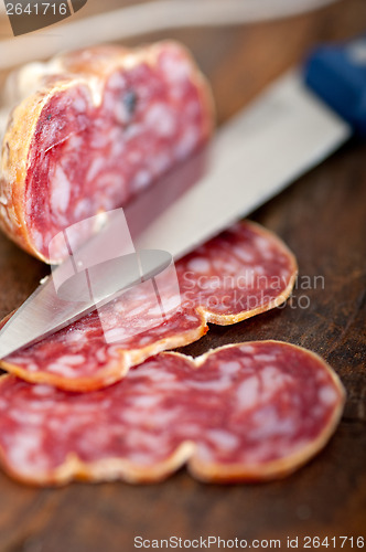 Image of italian salame pressato pressed slicing