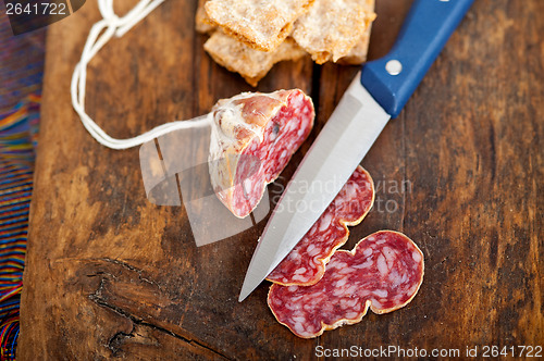 Image of italian salame pressato pressed slicing