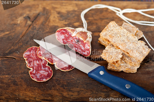 Image of italian salame pressato pressed slicing