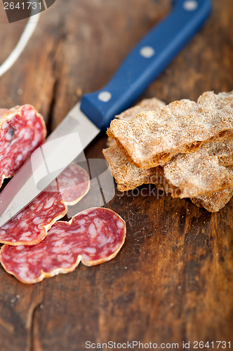 Image of italian salame pressato pressed slicing