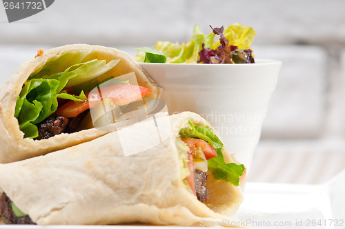 Image of kafta shawarma chicken pita wrap roll sandwich