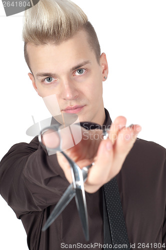 Image of Portrait of handsome man with pair of scissors