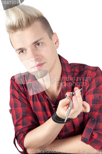 Image of Portrait of man in red with pair of scissors