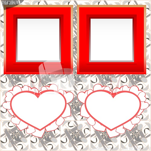 Image of two blank instant photo frames with heart shapes on wood