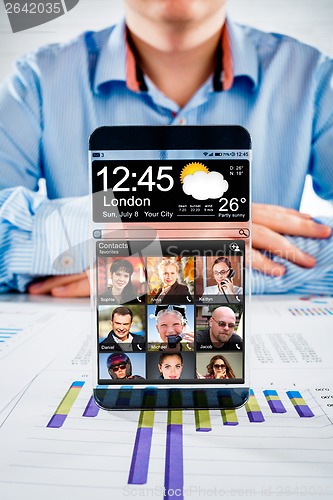 Image of Smartphone with transparent screen in human hands.