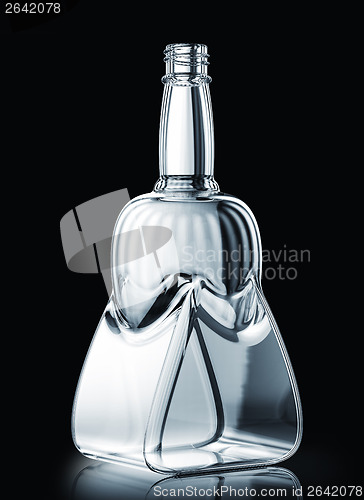 Image of Empty bottle for rum or scotch on black 