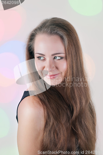 Image of Pretty woman looking back over her shoulder