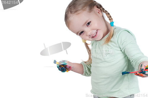 Image of Portrait of cute girl painting with paintbrush