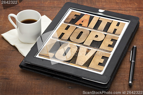 Image of faith, hope and love on digital tablet