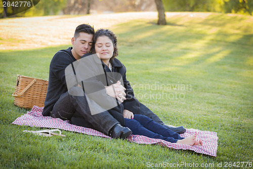 Image of Pregnant Hispanic Couple in The Park Outdoors