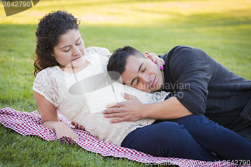 Image of Pregnant Hispanic Couple in The Park Outdoors