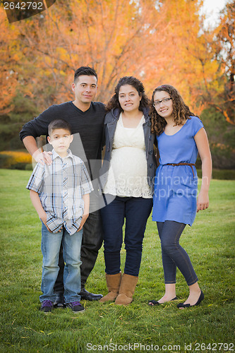 Image of Attractive Hispanic Family Portrait in a Colorful Fall Outdoor S