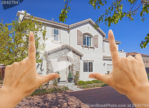 Image of Female Hands Framing Beautiful House