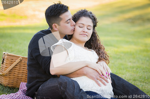 Image of Pregnant Hispanic Couple in The Park Outdoors