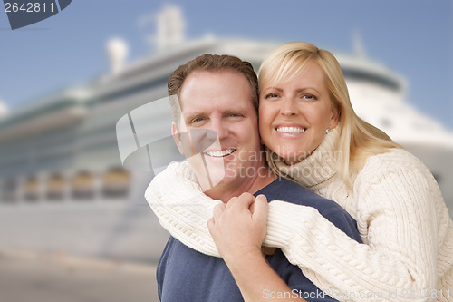 Image of Young Happy Couple In Front of Cruise Ship