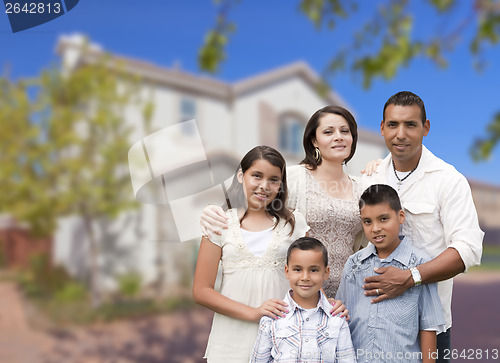 Image of Hispanic Family in Front of Beautiful House