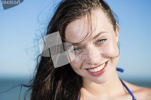 Image of Portrait of young smiling woman