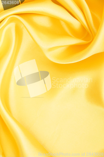 Image of Smooth elegant golden silk as background 