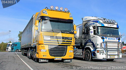 Image of Colorful Trucks on a Yard