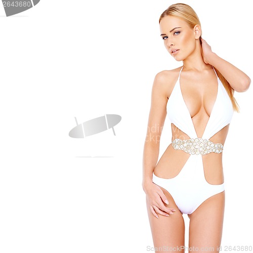 Image of Beautiful shapely woman in a white swimsuit