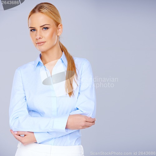 Image of Elegant stylish blond woman in smart casuals