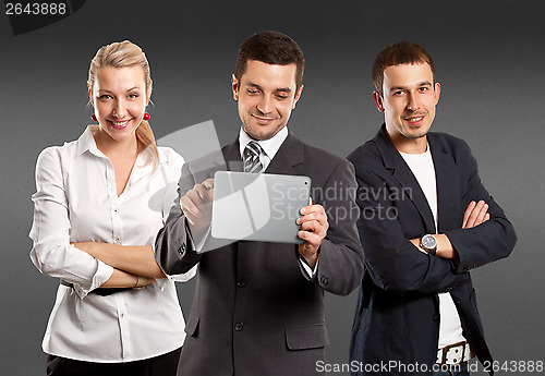 Image of Business Team With Touch Pad