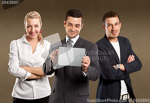 Image of Business Team With Touch Pad