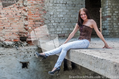 Image of Grunge portrait of a woman in urban ruins