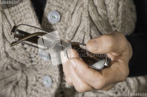 Image of Women hand hold glasses