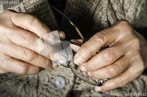 Image of Women hands hold glasses