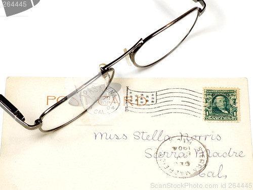 Image of Antique postcard and eyeglasses