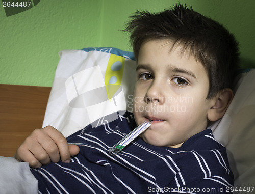 Image of Sick child in bed.
