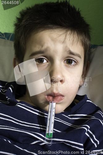 Image of Sick child in bed.
