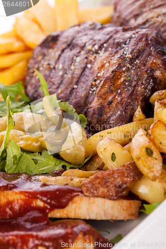 Image of Platter of mixed meats, salad and French fries