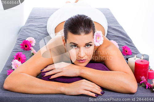 Image of Beautiful woman enjoying a hot stone massage