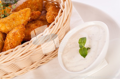 Image of Crumbed chicken nuggets in a basket